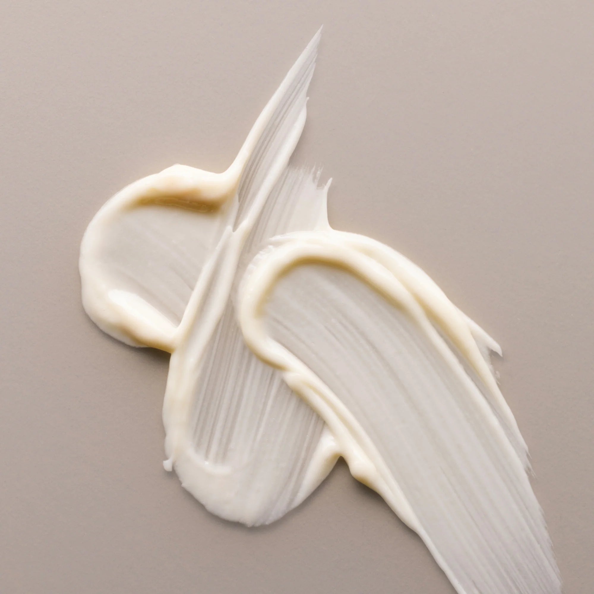 Antipodes Avocado Pear Night Cream white cream on a beige background