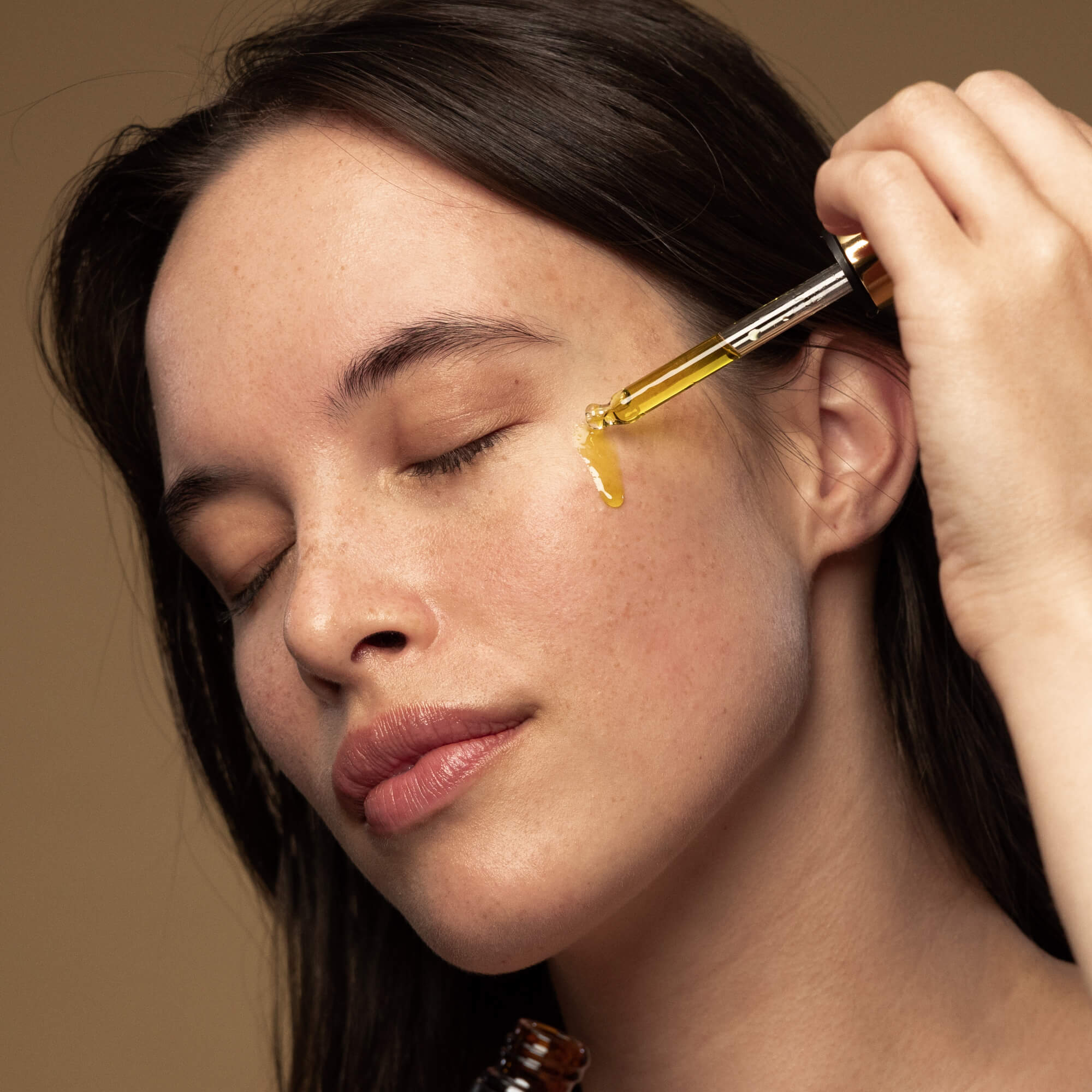 Antipodes Divine oil with a woman