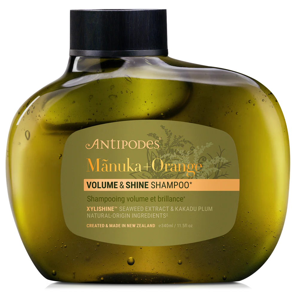 Antipodes Manuka + Orange Volume & Shine Shampoo bottle on a white background