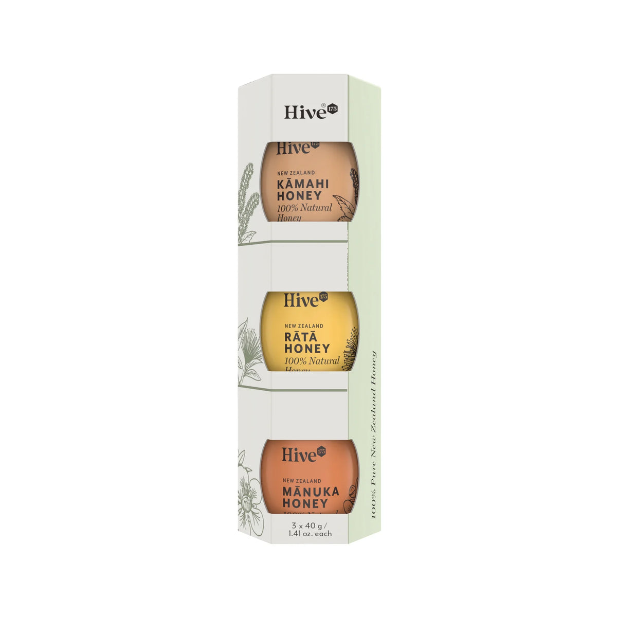 A boxed set of three Hive brand honey jars in a tall, narrow hexagonal package. The package is white and pale green, showing amber-colored honey through oval windows labeled Kamahi Honey, Bata Honey, and Manuka Honey.