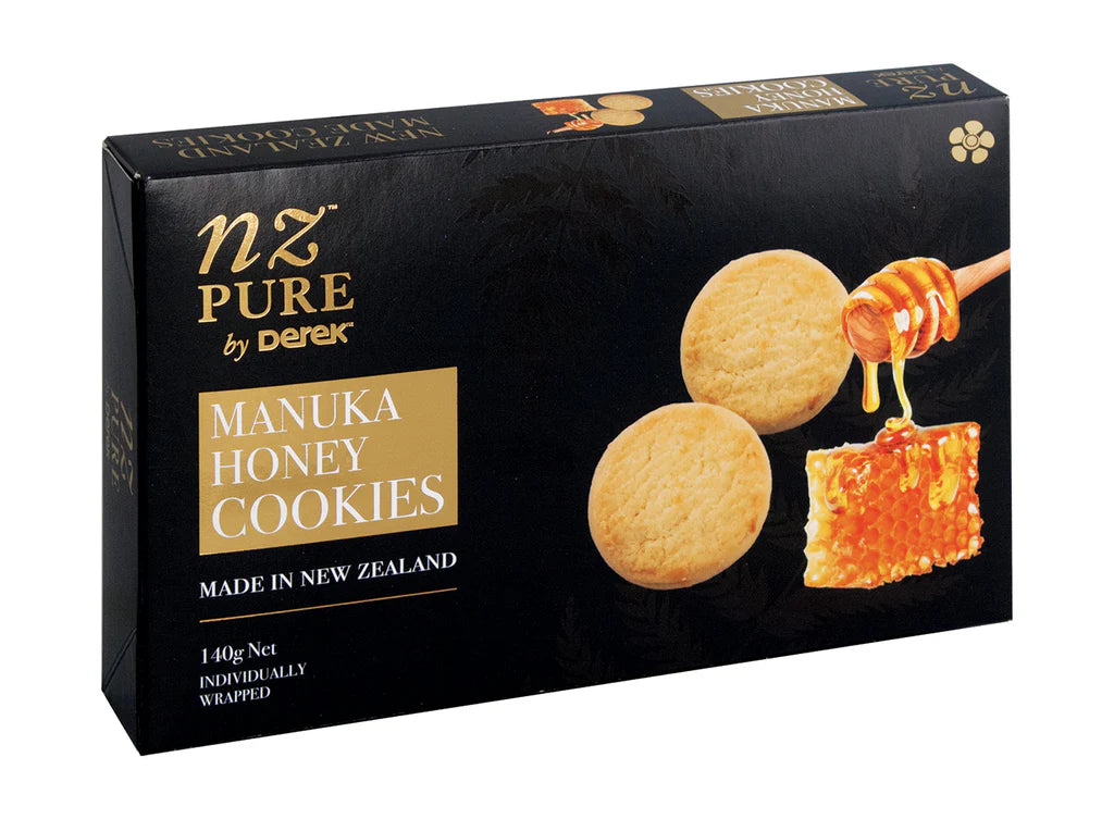 Box of NZ Pure by Derek Manuka Honey Cookies with honey being drizzled on a cookie.