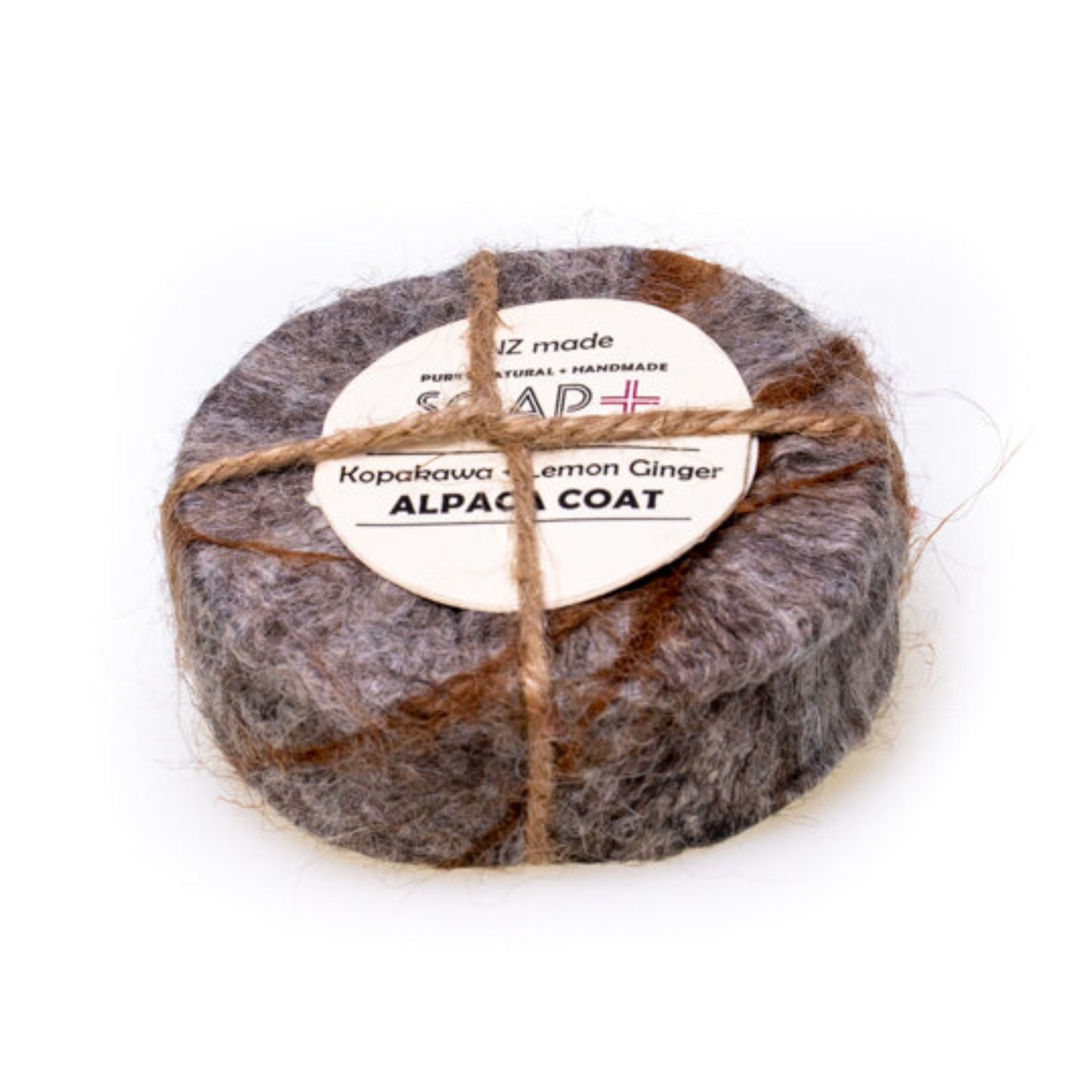 kopakawa lemon ginger Alpaca coat Soap with twine on a white background