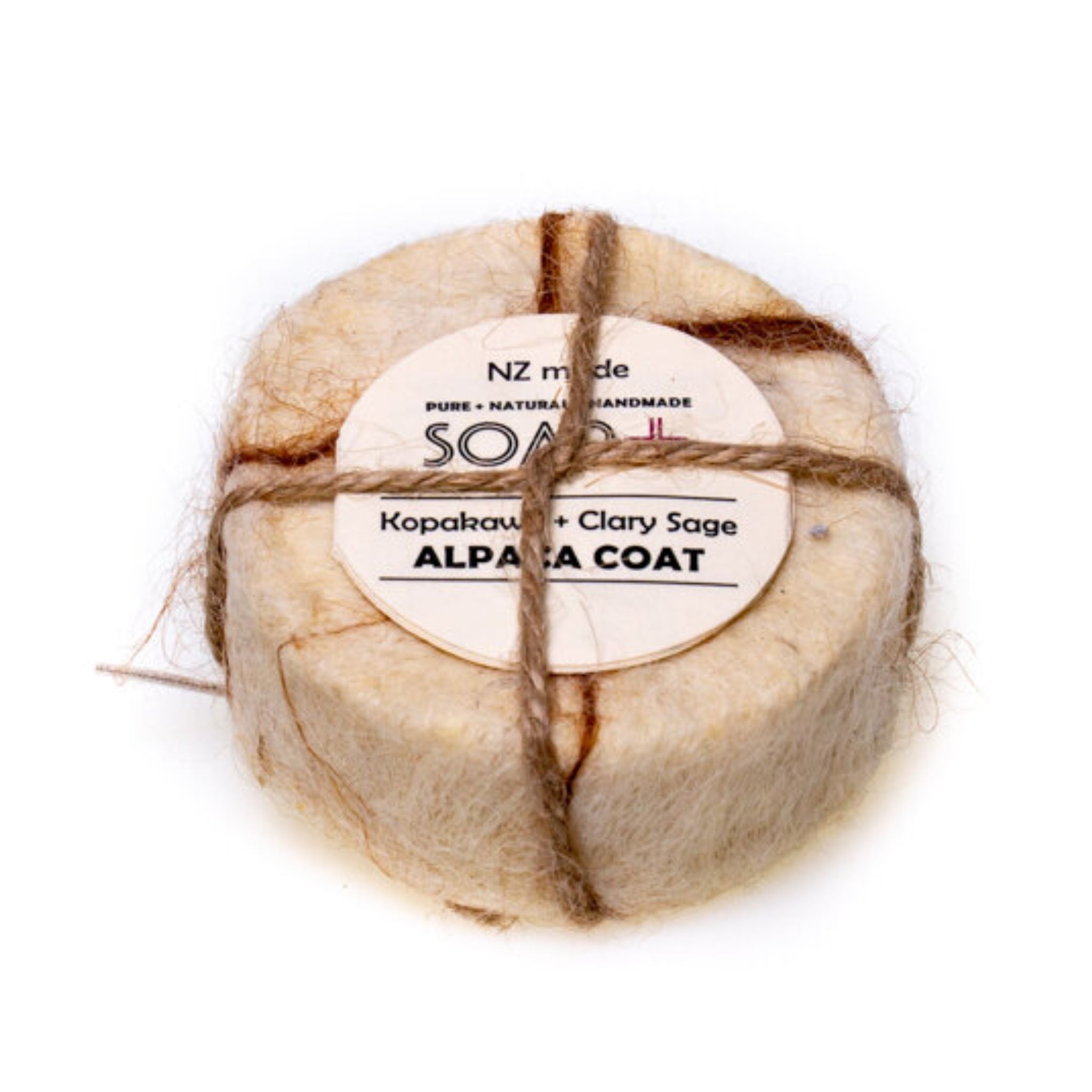 Soap plus KopaKawa + Clary Sage Alpaca Coat ith a label on a white background