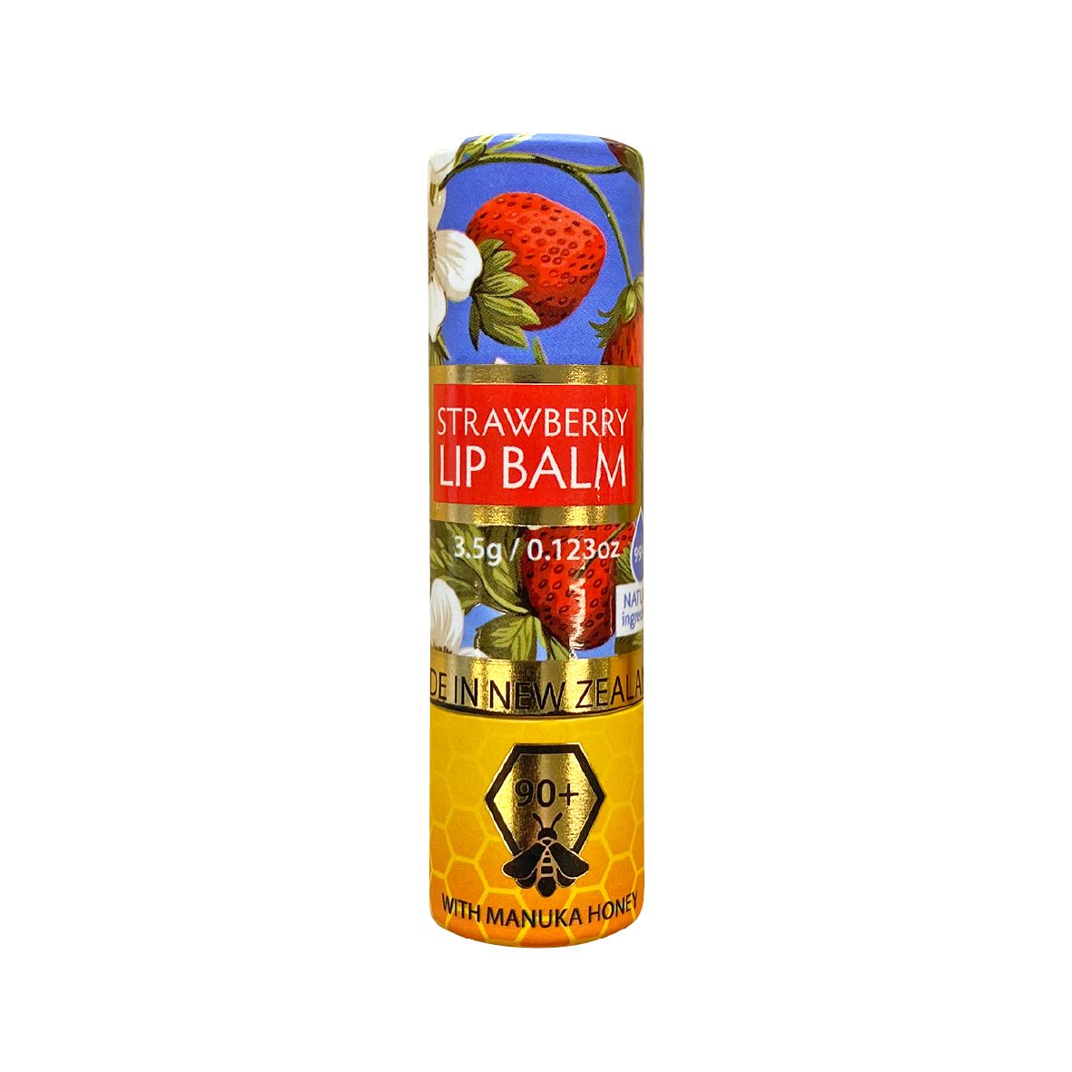 A tube of The Natural Land Strawberry Lip Balm with Manuka Honey, featuring an illustration of a strawberry and manuka honey, and text indicating the flavor and brand.