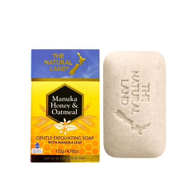 The Natural Land Manuka Honey & Oatmeal soap bar with packaging on a white background