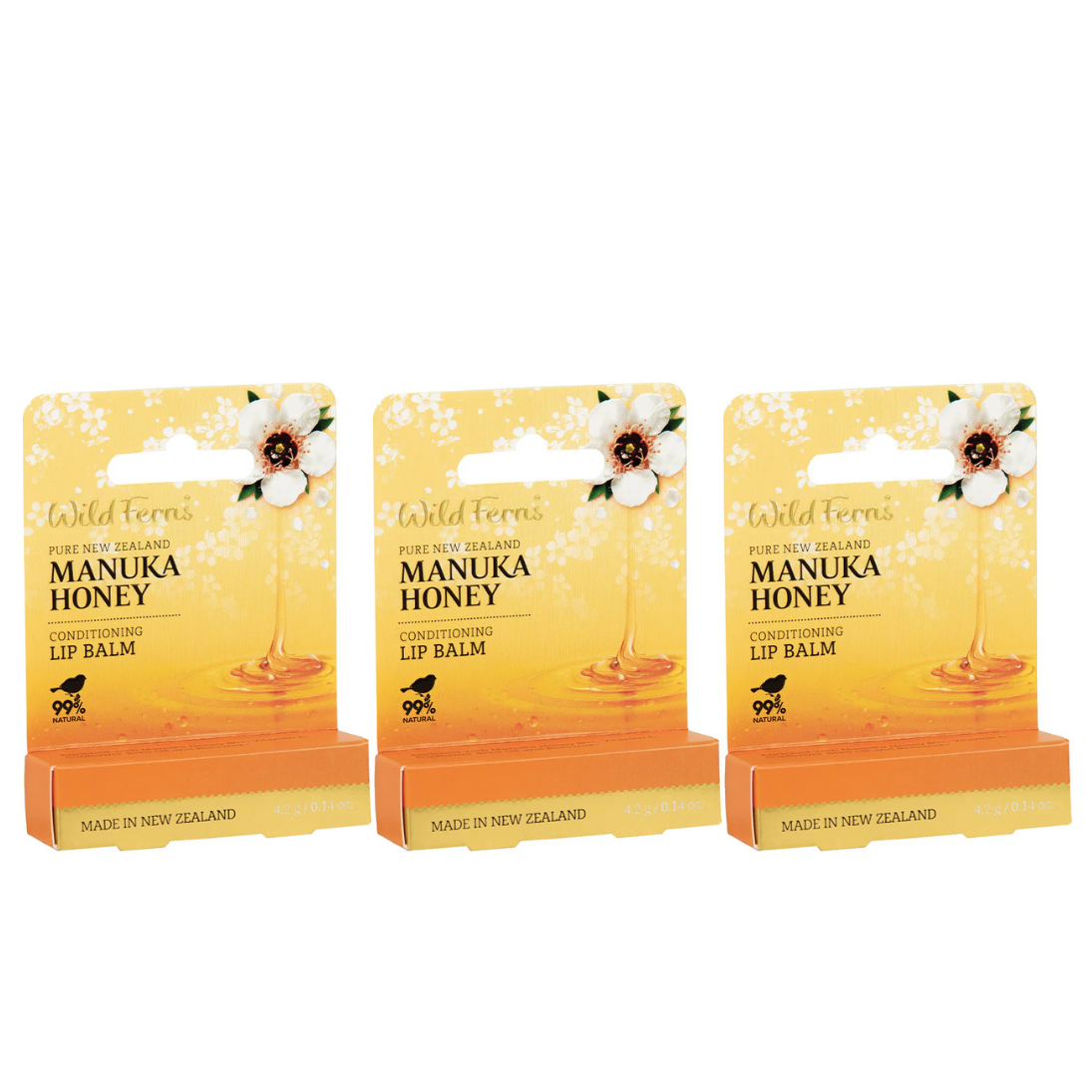 Three packages of Wild Ferns Manuka Honey lip balm on a white background