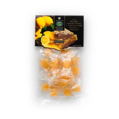 Packaging of Alpine Gourmet Foods Manuka Honey Lemon Drops showing the product in a clear plastic pouch with a label featuring an image of the honey drops and lemon slices.