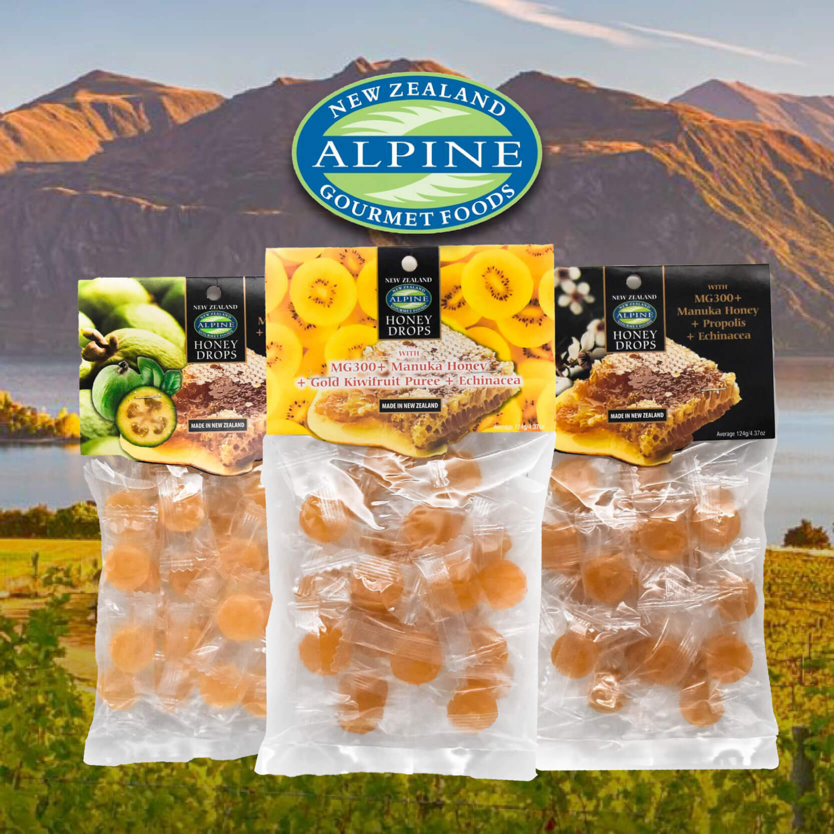 ALpine Gourmet Foods Manuka Honey Drops three kinds on a mountain seanery background