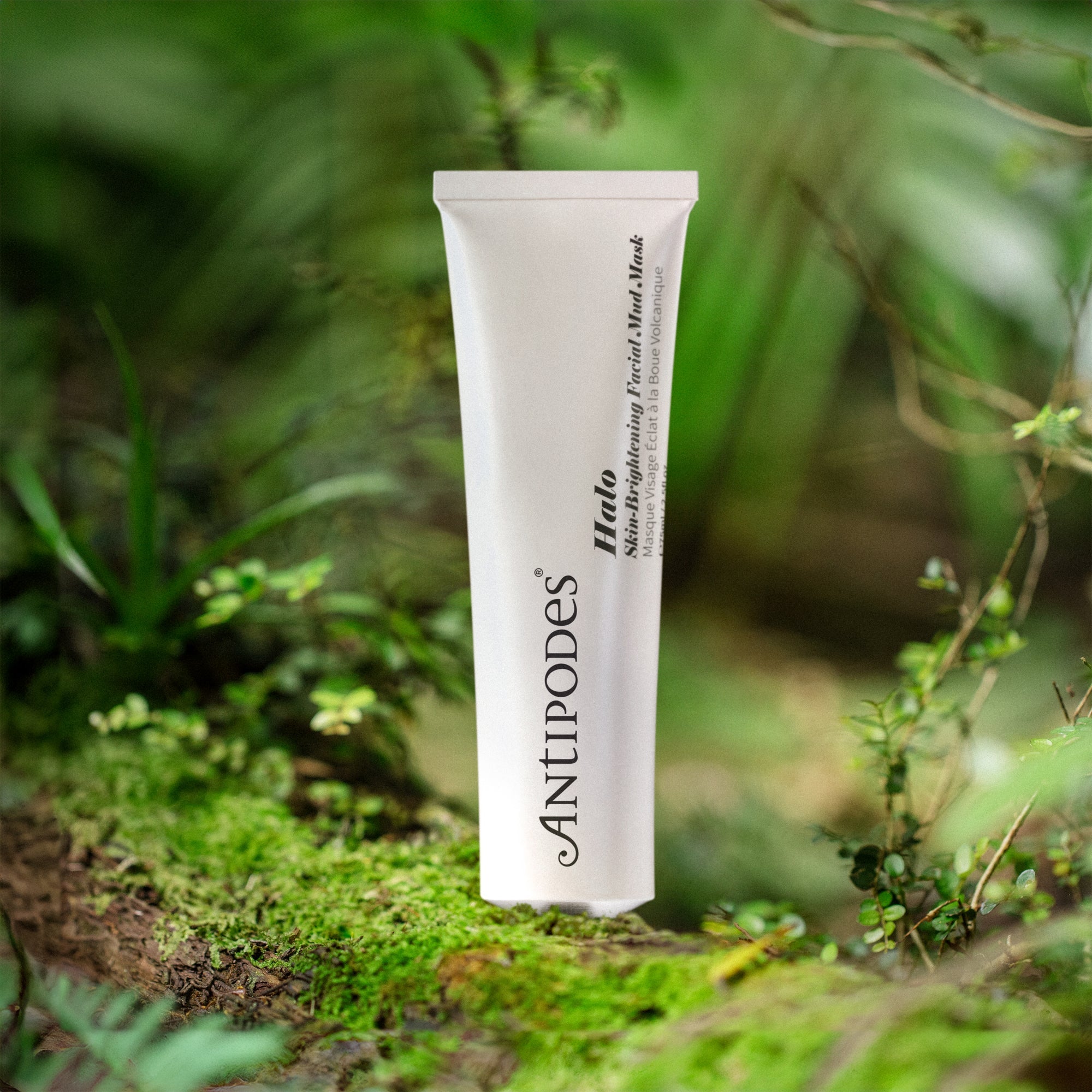 Tube of Antipodes Halo facial mud mask skincare product on a natural background