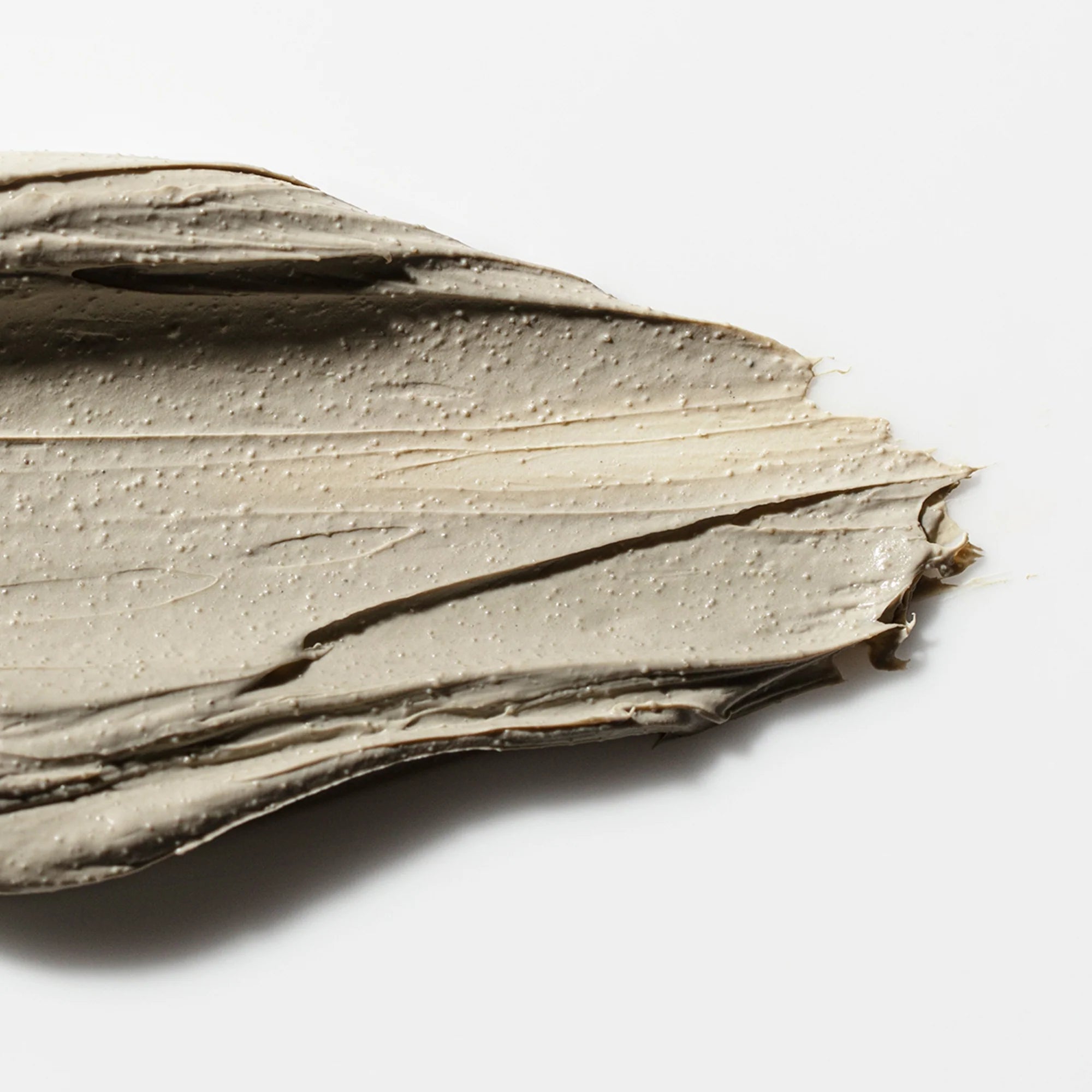 Close-up of a textured beige ANtipodes Halo on a white background