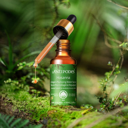 Antipodes Hosanna skincare serum bottle with dropper on a natural background