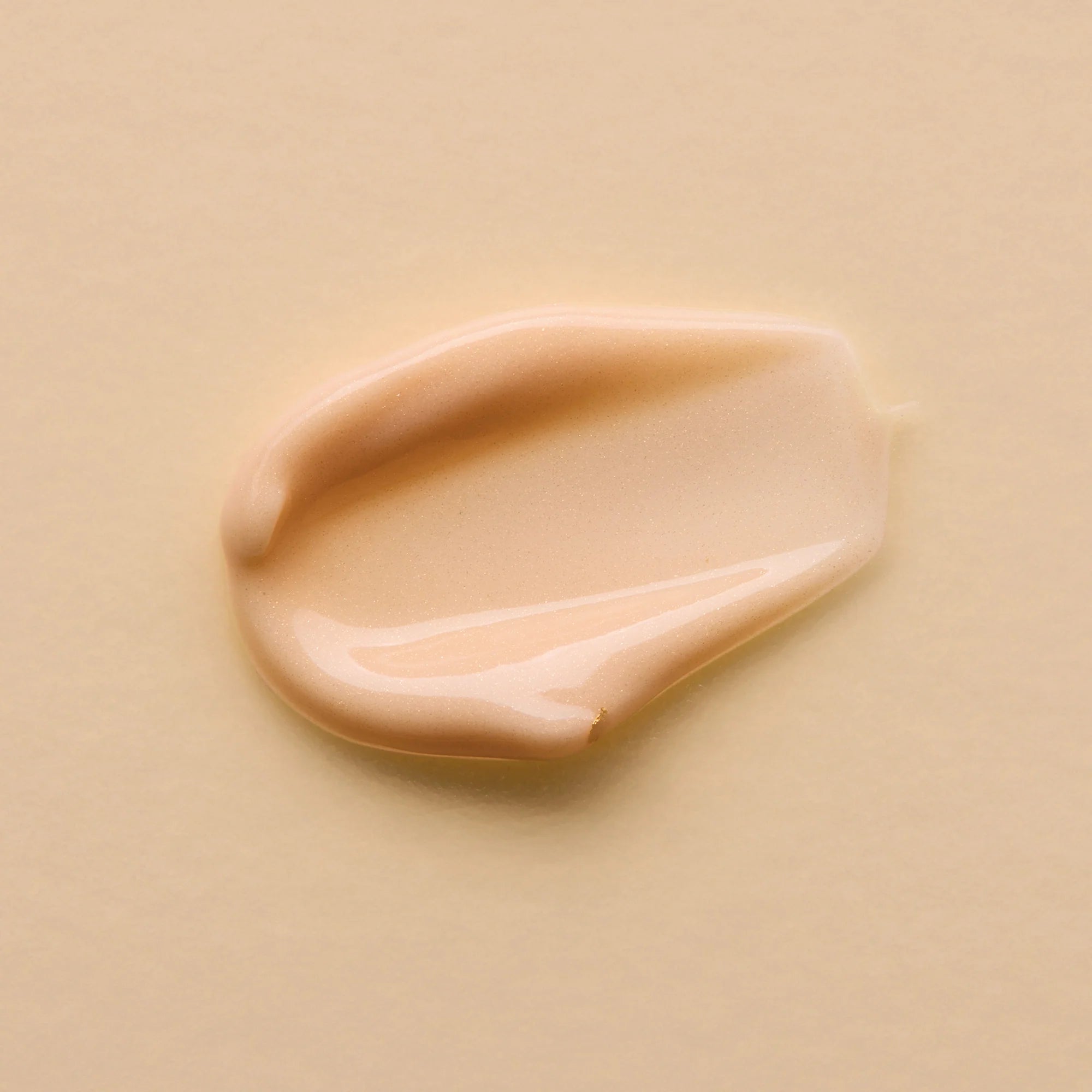 Beige cream of Antipodes Kiwi Seed Eye Cream on a beige background