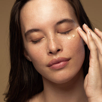 Antipodes kiwi seed eye cream with a woman