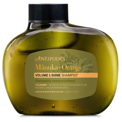 Antipodes Manuka + Orange Volume & Shine Shampoo bottle on a white background