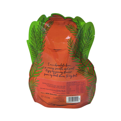A squeeze pouch of chocolate loli shaped like a pear, featuring a bright orange center with green leaf illustrations on the sides and a red label on the front showing product details.