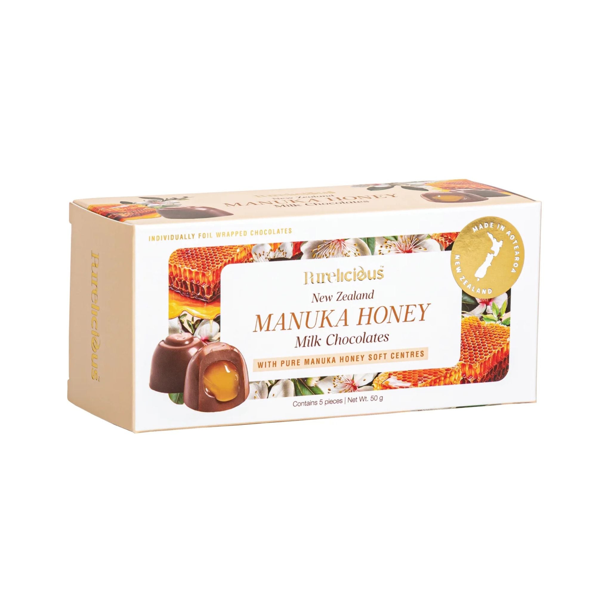 A box of Purelicious New Zealand Manuka Honey Milk Chocolates, featuring a cream-colored packaging with illustrations of honeycomb, a honey pot, and milk chocolate pieces, set against a plain white background.