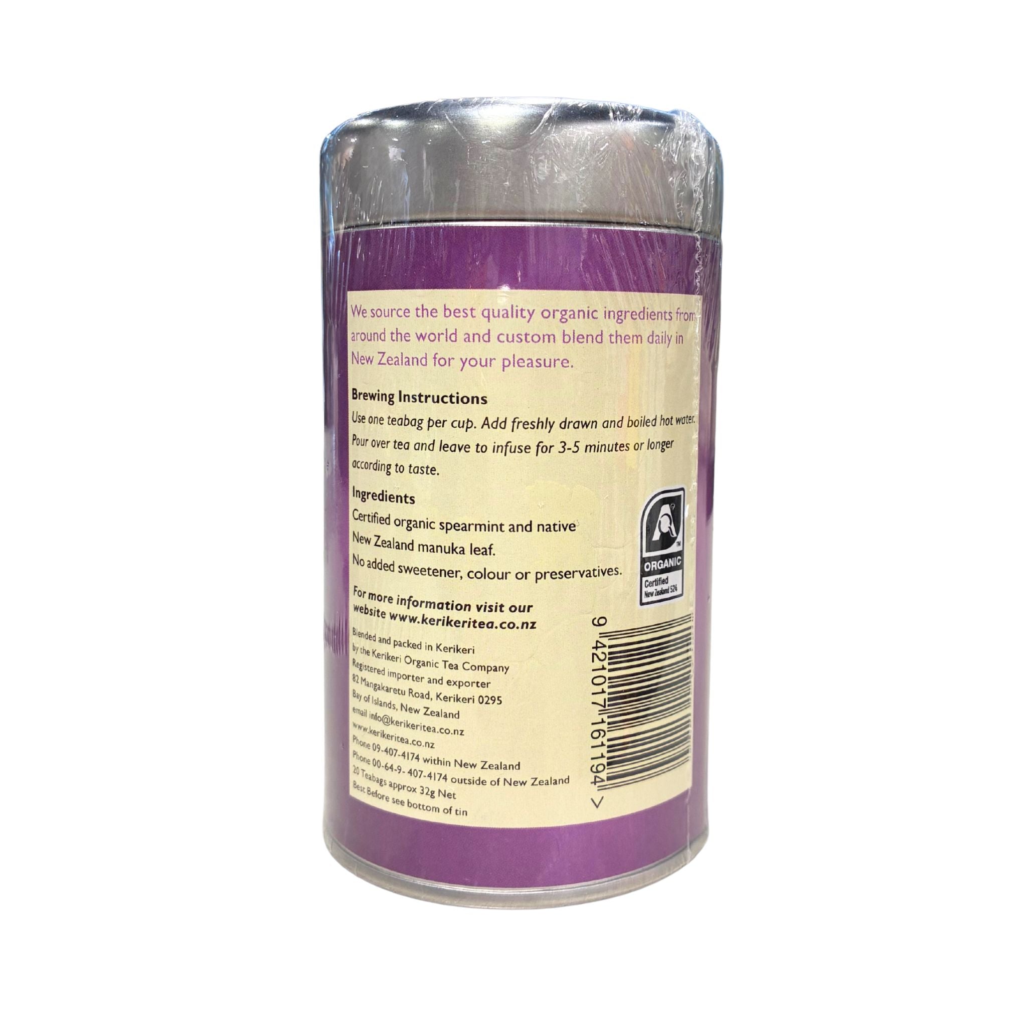 A cylindrical plastic canister of Kauri Tea Company organic ingredients, showing the back label with brewing instructions and a barcode on a white background.