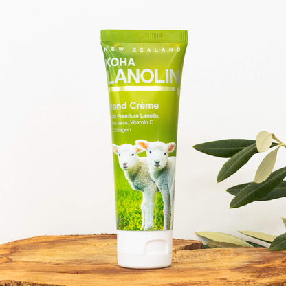 Tube of New Zealand Koha Lanolin Hand Creme with lambs on a wooden surface