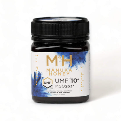 M&H Manuka Honey UMF 10+ 250g jar with black lid on a white background