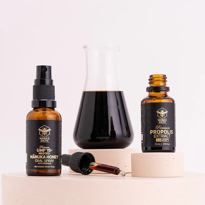 Three bottles of Manuka Health products on a white background