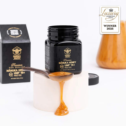 Manuka South Manuka honey UMF 15+ 250g jar with honey on a spoon, packaging, and a 'Winner 2025' badge on a white background