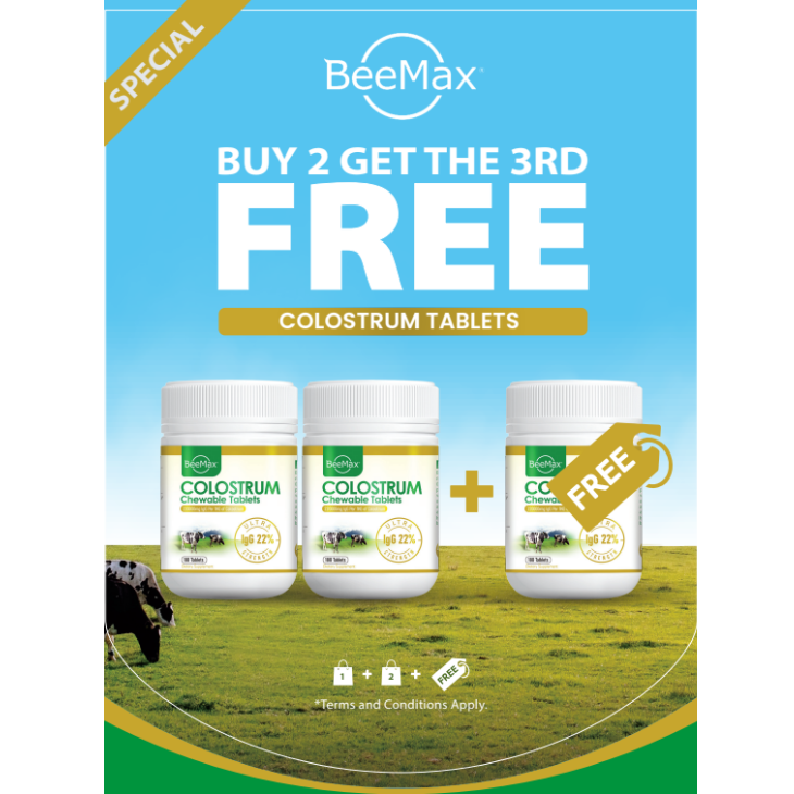 BeeMax colostrum tablets promotion with three bottles on a grassy field background