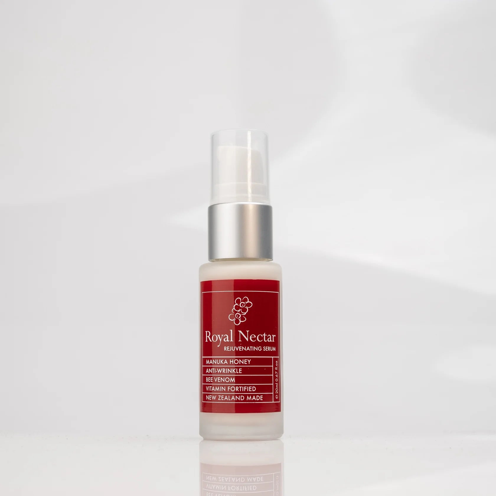 Royal Nectar Vee Venom Rejuvenating  serum bottle with red label on a white background