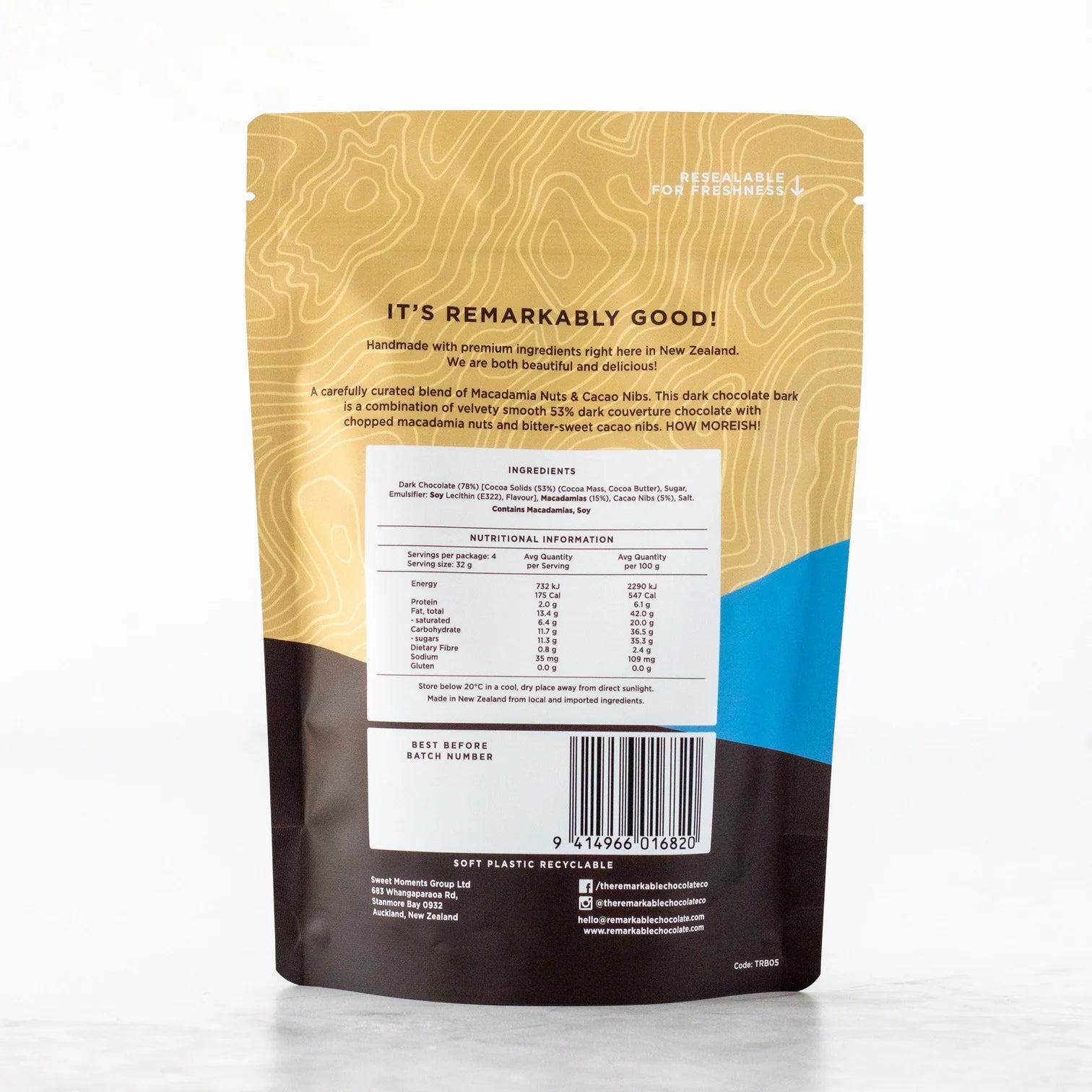 Back view of a remarkable chocolate bark with macadamia packaging with text and nutritional information on a white background
