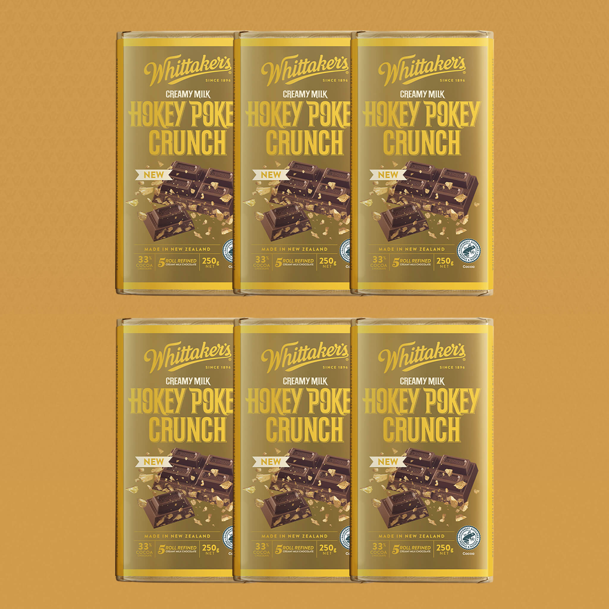 Six packs of Whittaker's Hokey Pokey Crunch chocolate bars on a brown background