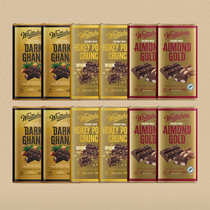 Collection of Whittaker's chocolate bars in various flavors on a beige background