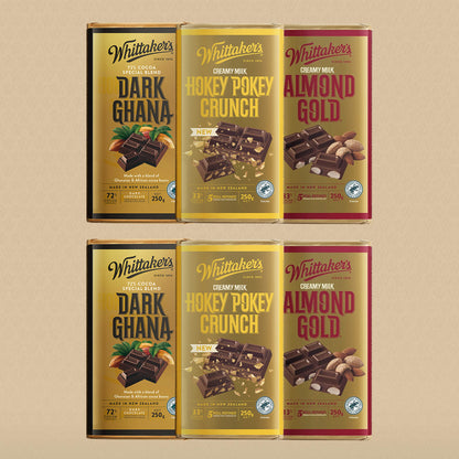 Six Whittaker's chocolate bars on a beige background