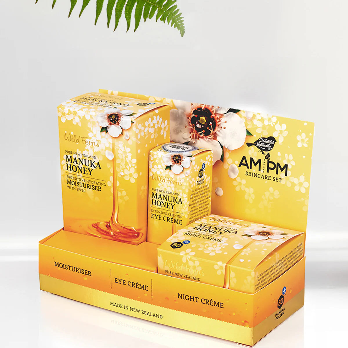 Wild Ferns Manuka Honey AM/PM skincare set packaging with a fern leaf on a light background