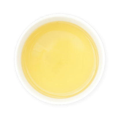 Zealong Tea organic green tea in a white cup on a white background