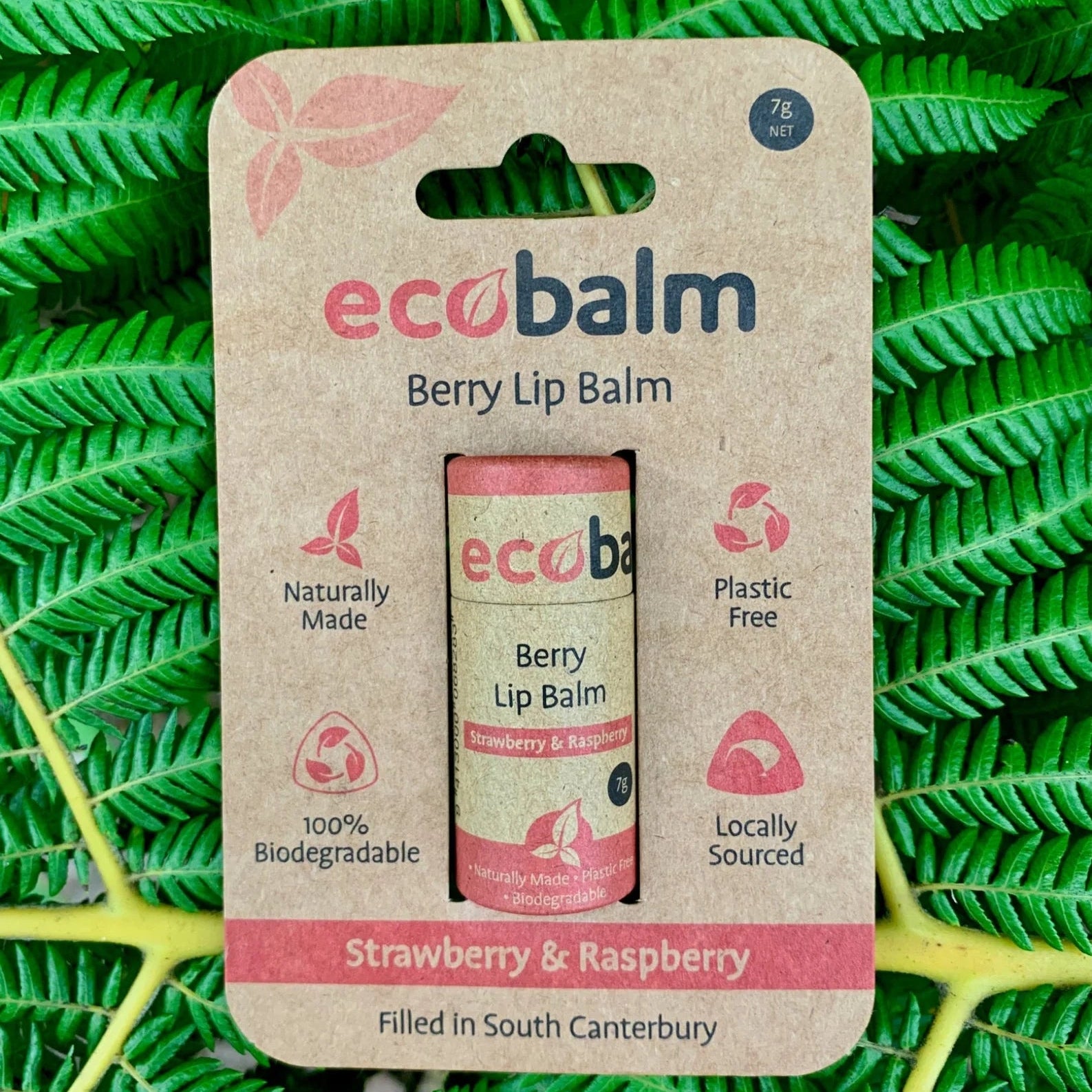 ecobase ecobalm berry lip balm packaging on a green leafy background
